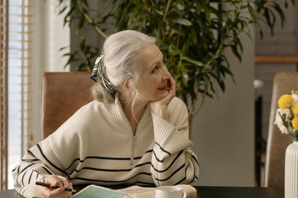 Older woman relaxed and happy at home with personalised care